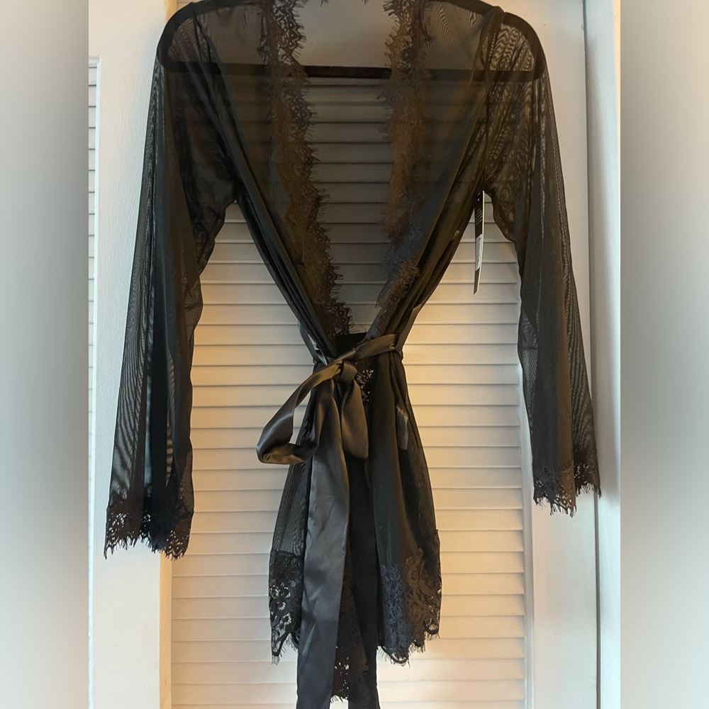 Never worn. Sexy sheer robe with lace trim and thong to match.